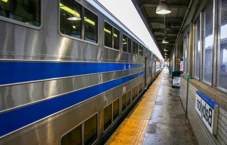 A long Island Railroad Train is arriving from the east at the Babylon Station.